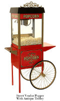 Early American styled popcorn machine with matching popcorn trolley. Full featured machine includes Old Maid's Tray and lower heating unit.